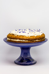 Carrot cake isolated. white background, blue plate.  
