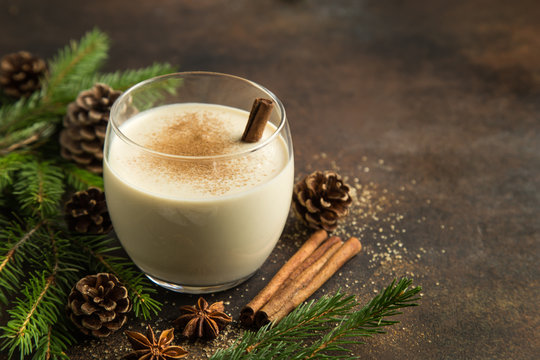 delicious winter eggnog with grated nutmeg and cinnamon for Christmas
