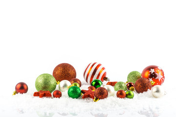 Fototapeta na wymiar Many Christmas tree balls in the snow