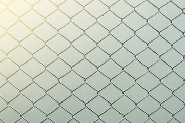 Metal wire fence protection chainlink background,
Soft light concept