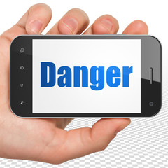 Protection concept: Hand Holding Smartphone with blue text Danger on display, 3D rendering