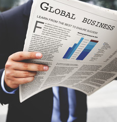 Businessman reading the financial news