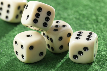 Five rolling dices in motion