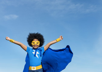 Girl with afro playing superhero