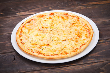 pizza on the wooden background