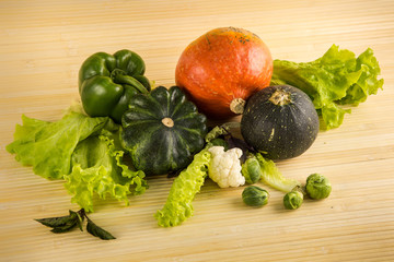 big pumpkins green salad leaves green pepper and brussels sprouts