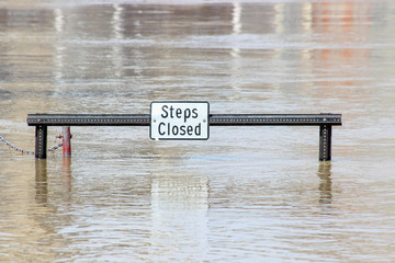 Steps Closed Sign Near River Flood