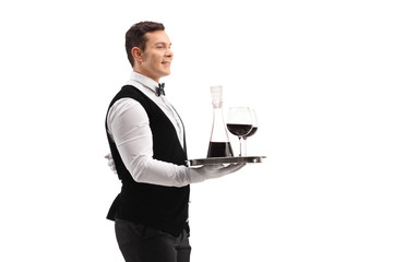 Waiter holding a tray with wine and two glasses