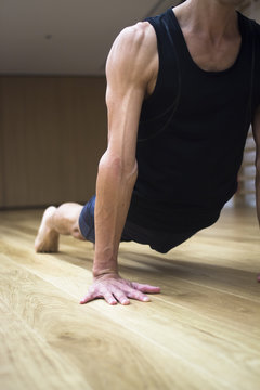 Man yoga teacher in gym