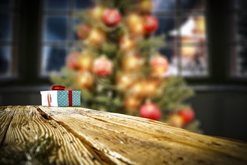 A table with space for your decorations. The lamp shines in orange light. Big window overlooking the mountains and the moon.