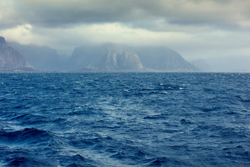 View of mountain seashore. Open sea. Beautiful nature Norway. Lofoten islands