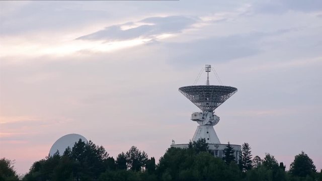 Satellite array at the Center of the Space Communication with flying birds.