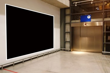 blank showcase billboard or advertising light box for your text message or media content in front of elevator in subway, airport or department store shopping mall, commercial and marketing concept