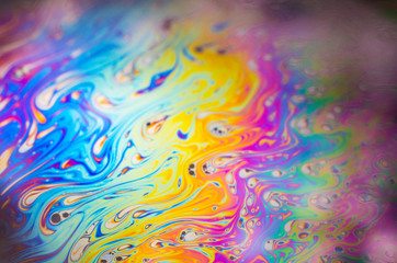 Fototapeta premium Beautiful psychedelic abstraction formed by light on the surface of a soap bubble