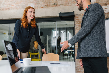 Smiling redhead woman on a first job interview
