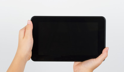 E-book in girls hands on white background