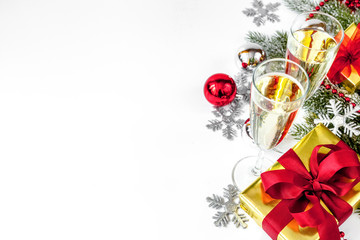 glasses of champagne and Christmas ornaments top view