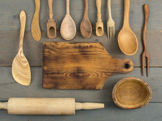 wooden kitchen accessories on a wooden background.  - obrazy, fototapety, plakaty