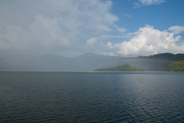 beautiful sky with Rainbow over mountain peak

