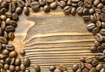 Coffee beans on wooden background