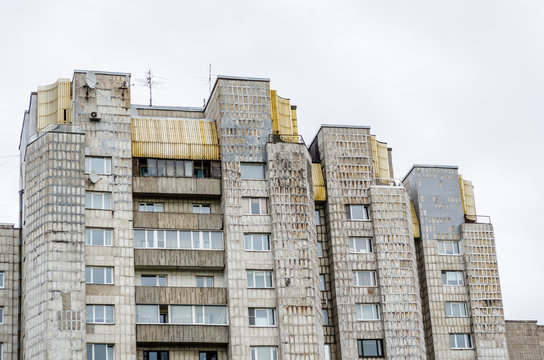 Old multi-storey houses, with holes in concrete.