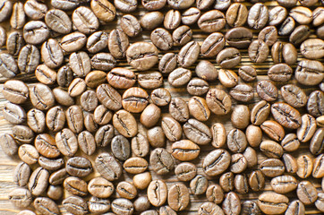 Coffee beans on wooden background 