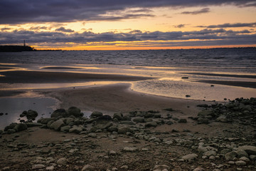 Shore of Baltic Sea on sunset, Gulf of Finland in Peterhof, Russian town near Saint Petersburg
