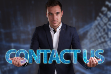 The concept of business, technology, the Internet and the network. Young businessman showing inscription: Contact us