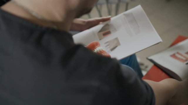 Dentist showing artificial jaw at the dental office. Concept of hygiene and healthy mouth.