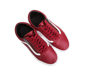 Fashion shoes with shoestring. Red sneaker and shoelace on white background