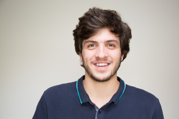 handsome young man unshaven with a big smile