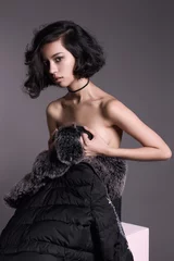 Raamstickers nude woman in winter coat with fur © photoagents