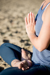 Woman practicing yoga in the sand - Meditation - Autumn day