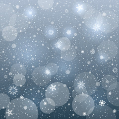 Fototapeta na wymiar glowing snowflakes blue bokeh