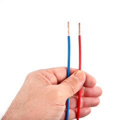 Red and Blue Wires in a Hand