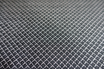 Close view of grey fabric with diamonds pattern
