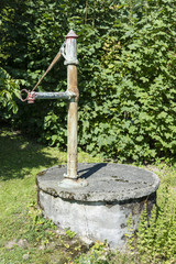 Hand-made metal well.