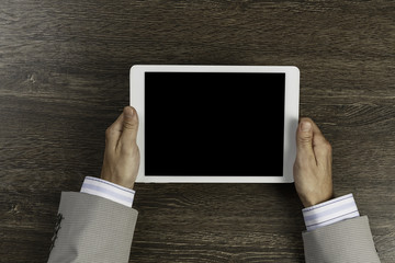Tablet pc with blank screen in hands