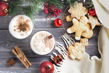 Glass of eggnog on wooden background