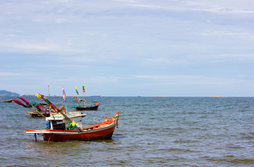 Naklejka na ściany i meble Boat floating in the sea of Thailand.