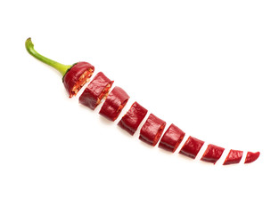 Sliced chili pepper. Cut red hot chili pepper on white
