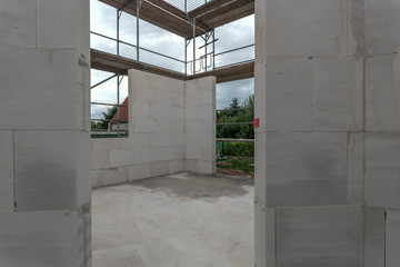 View of the shell of a ground floor of a residential house. A detached house is built in solid construction