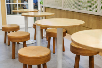 Brown wooden table and chair set for breakfast, lunch and dinner - interior concept.