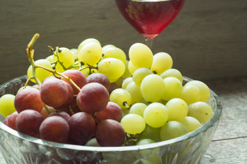 wine and colorful grapes