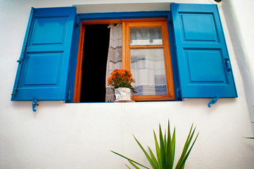 Greece, Cyclades islands, Mykonos, decorative flower pot on a window.