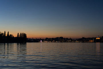 sunset over lake lucerne with water and red sky