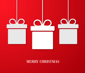 Christmas paper card with hanging gift boxes.