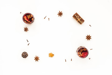 Traditional christmas mulled wine. Spices, cinnamon sticks, cardamom, anise, bottle of wine, citrus fruit, ginger on white background, flat lay, top view