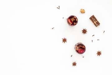 Traditional christmas mulled wine. Spices, cinnamon sticks, cardamom, anise, bottle of wine, citrus fruit, ginger on white background, flat lay, top view