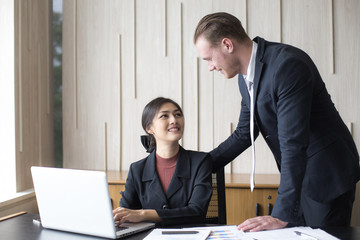 Businessman training to secretary about how to work at office, man with relax time concept.